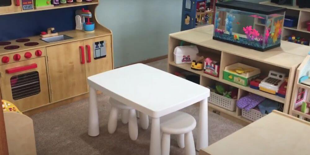 daycare centre cleaning, commercial cleaning Melbourne, carpet cleaning, photo of playroom with white table and chairs and play kitchen